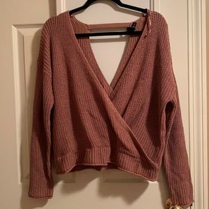 Women’s pink cross sweater.
